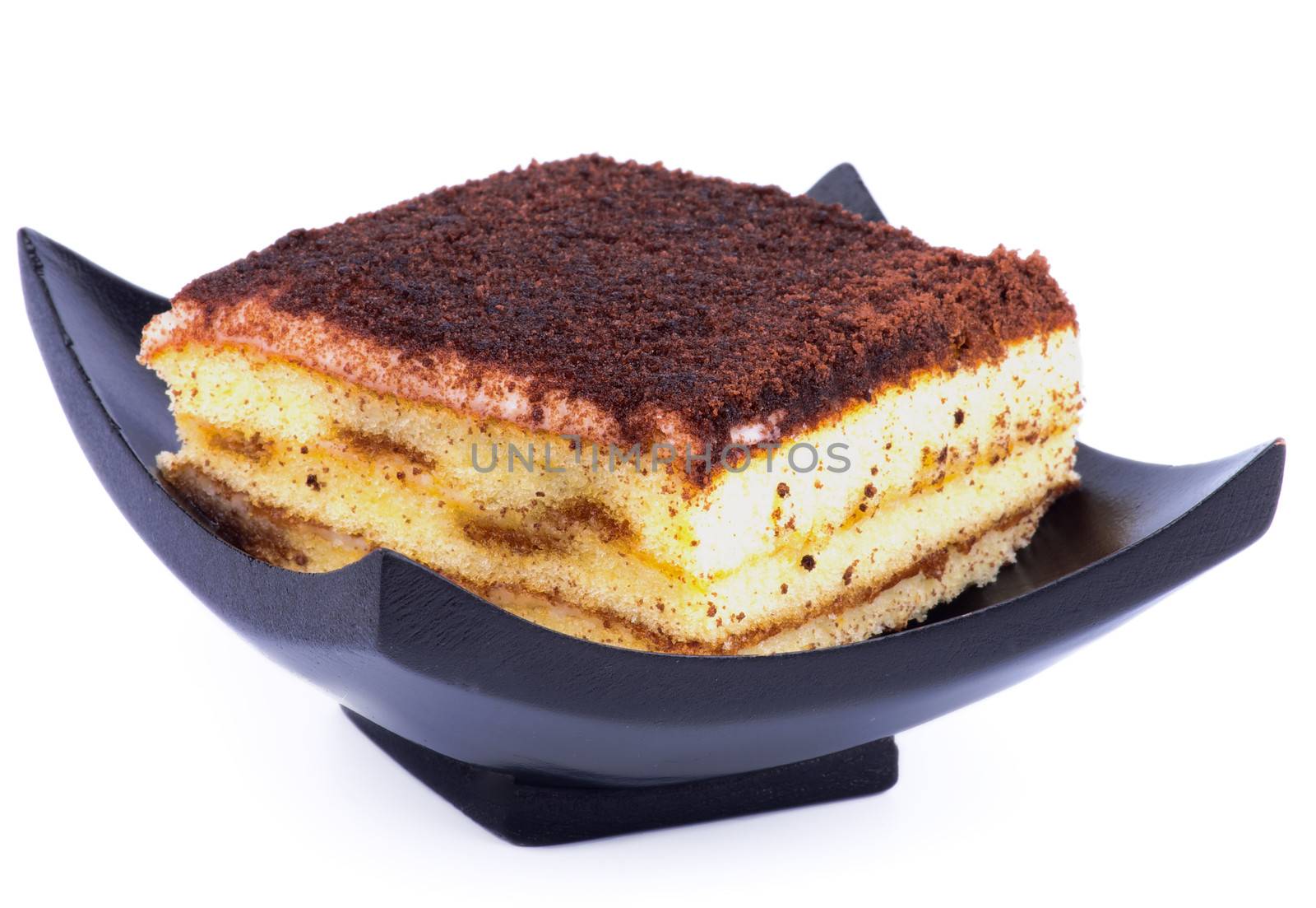 Delicious Tiramisu Dessert in Black Plate isolated on white background