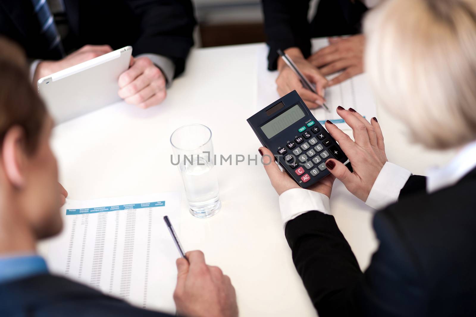 Business people having meeting together by stockyimages