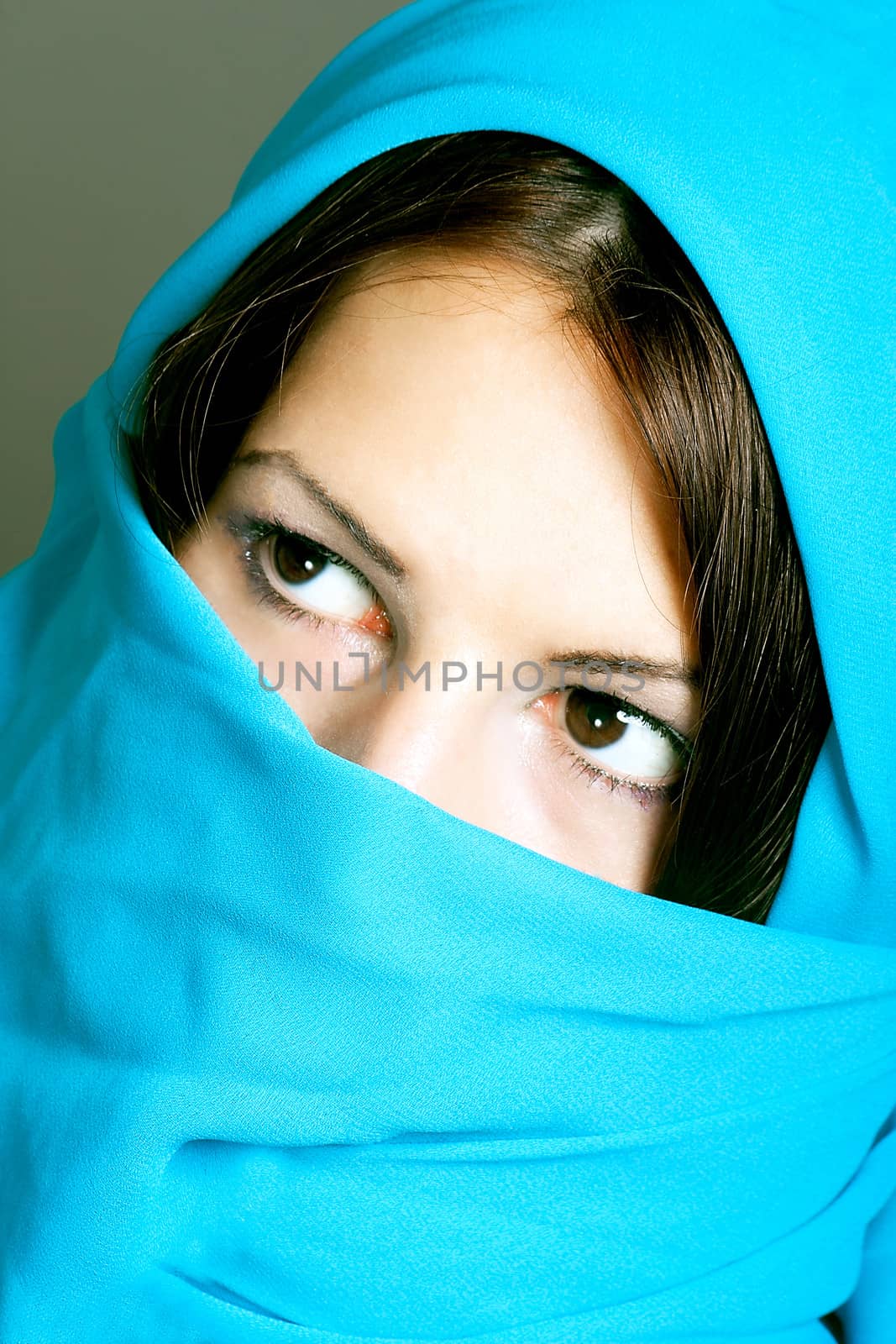 portrait of beautiful arabic woman wearing scarf