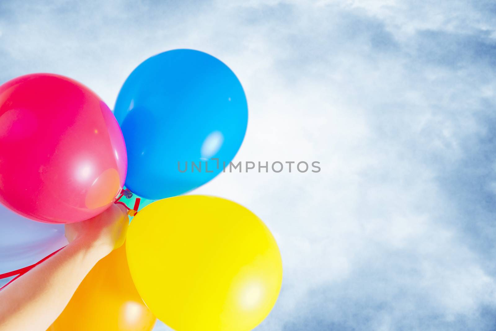 multicolored balloons against the sky