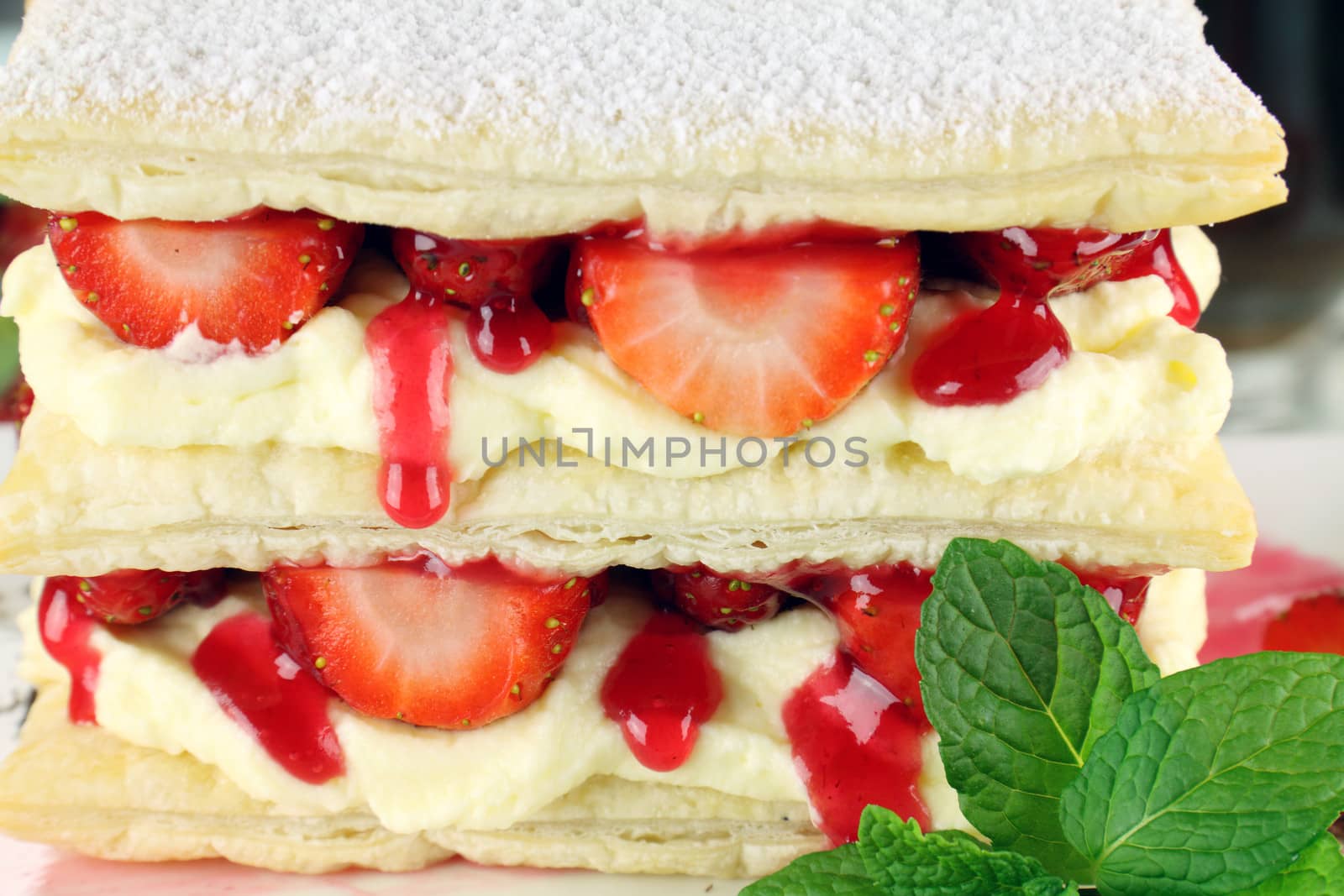 Delicious strawberry mille feuille with fresh strawberries and cream.