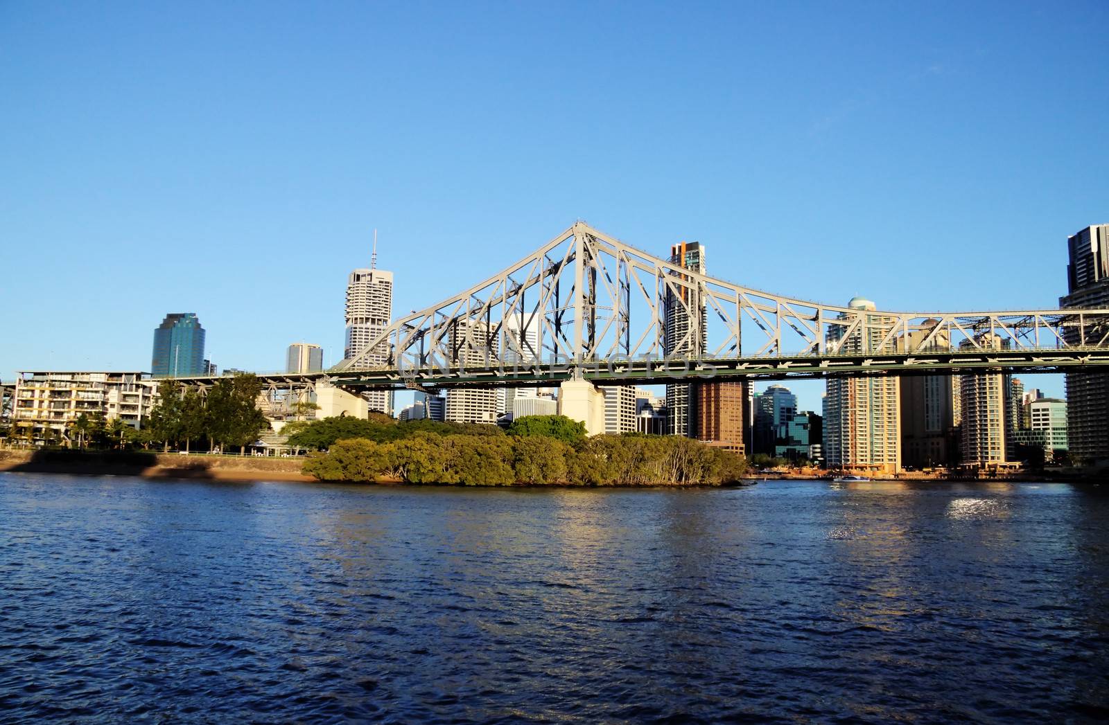 The iconic Story Bridge spanning the Brisbane River in Brisbane Australia at sunrise.