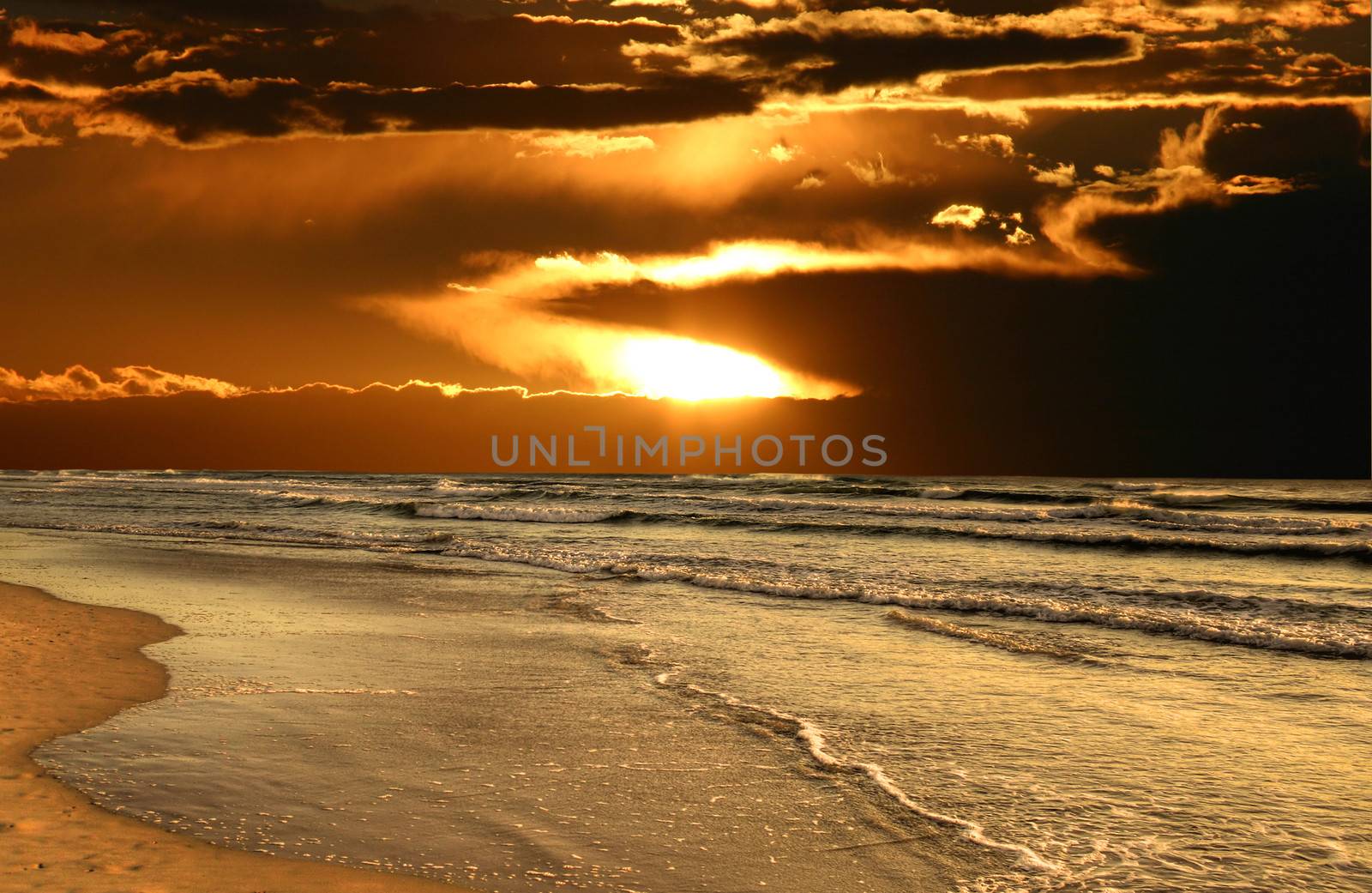 Sun Breaks Through Over Beach by jabiru