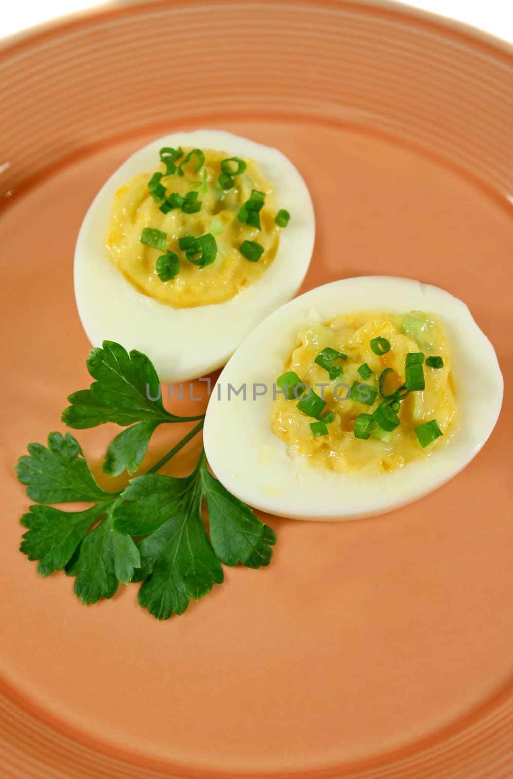 Delicious stuffed eggs with diced chives.