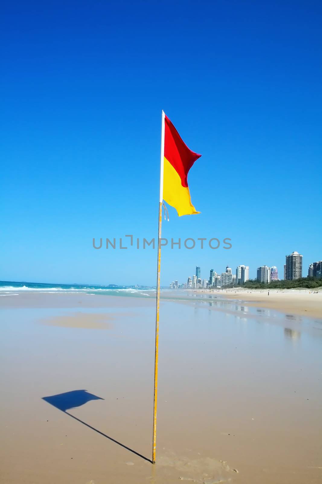 Swimming safety flag on the Gold Coast Northern beach looking towards Surfers Paradise.