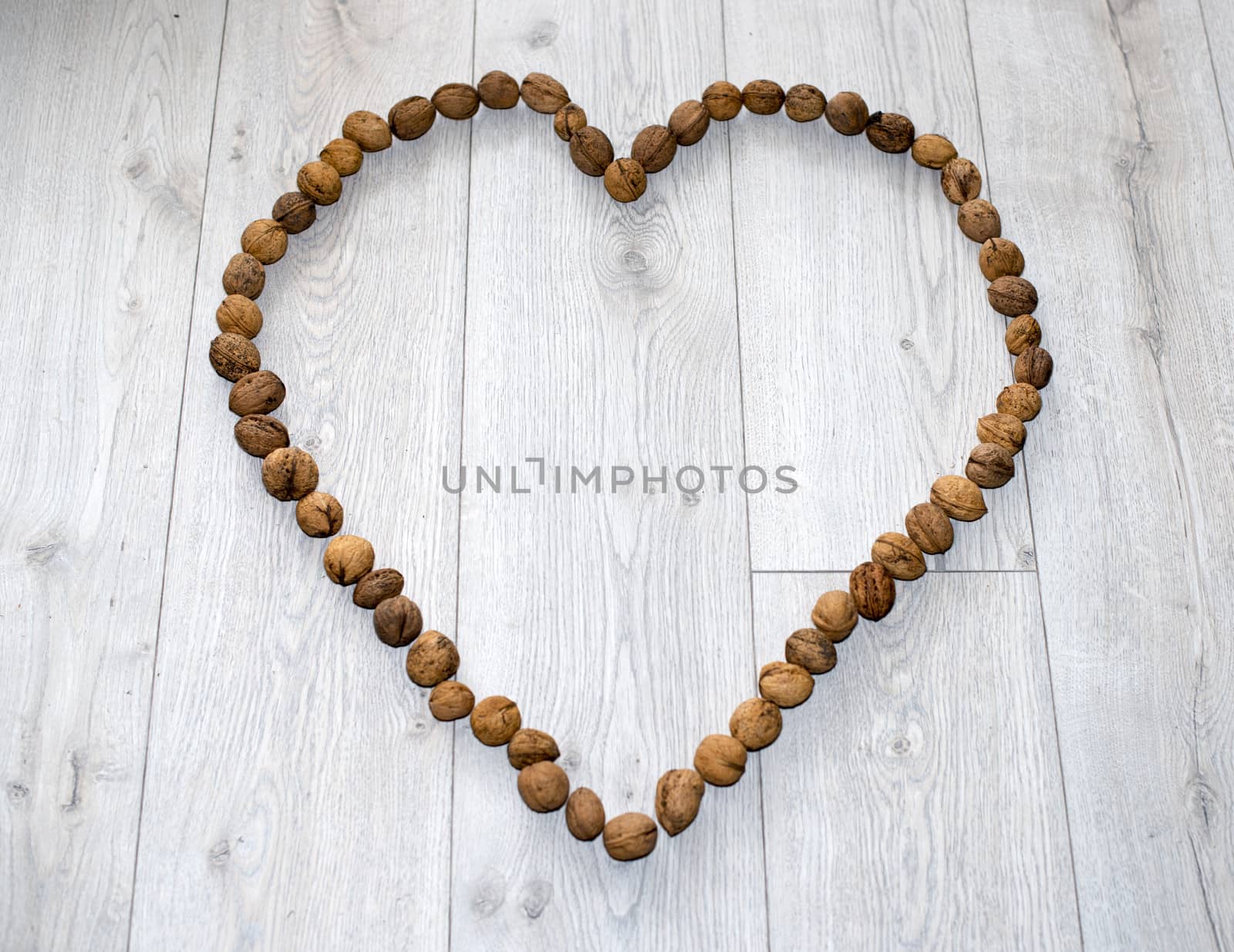 heart shape from wallnuts on floor