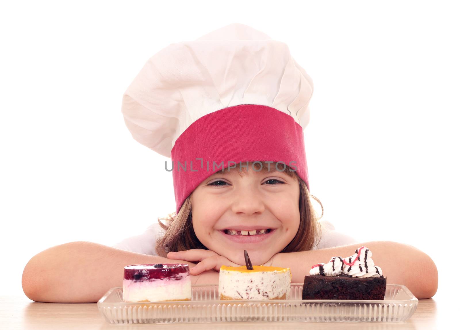 happy little girl cook with cakes