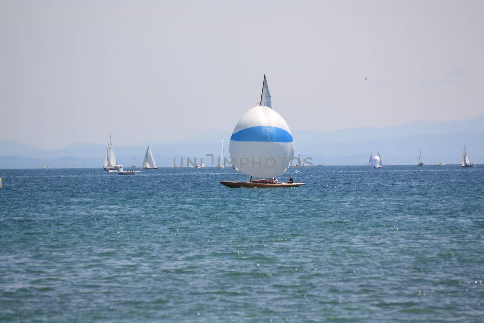 Lake of Constance with sailing boats and view of alps 