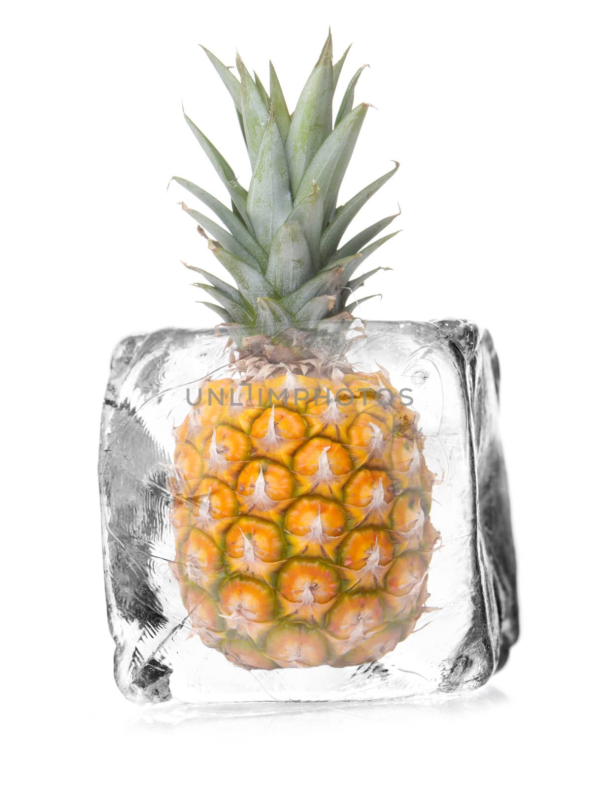 pineapple in a ice cube isolated with white background 