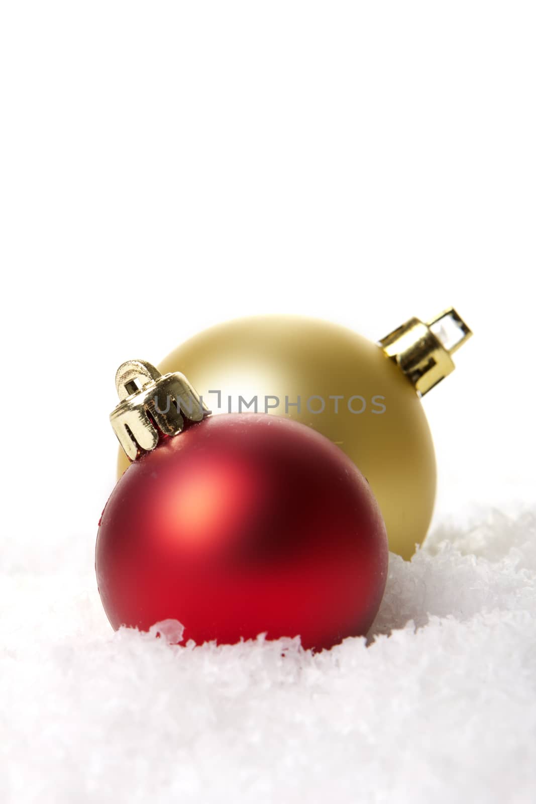 christmas, red and golden christmas balls on snow 