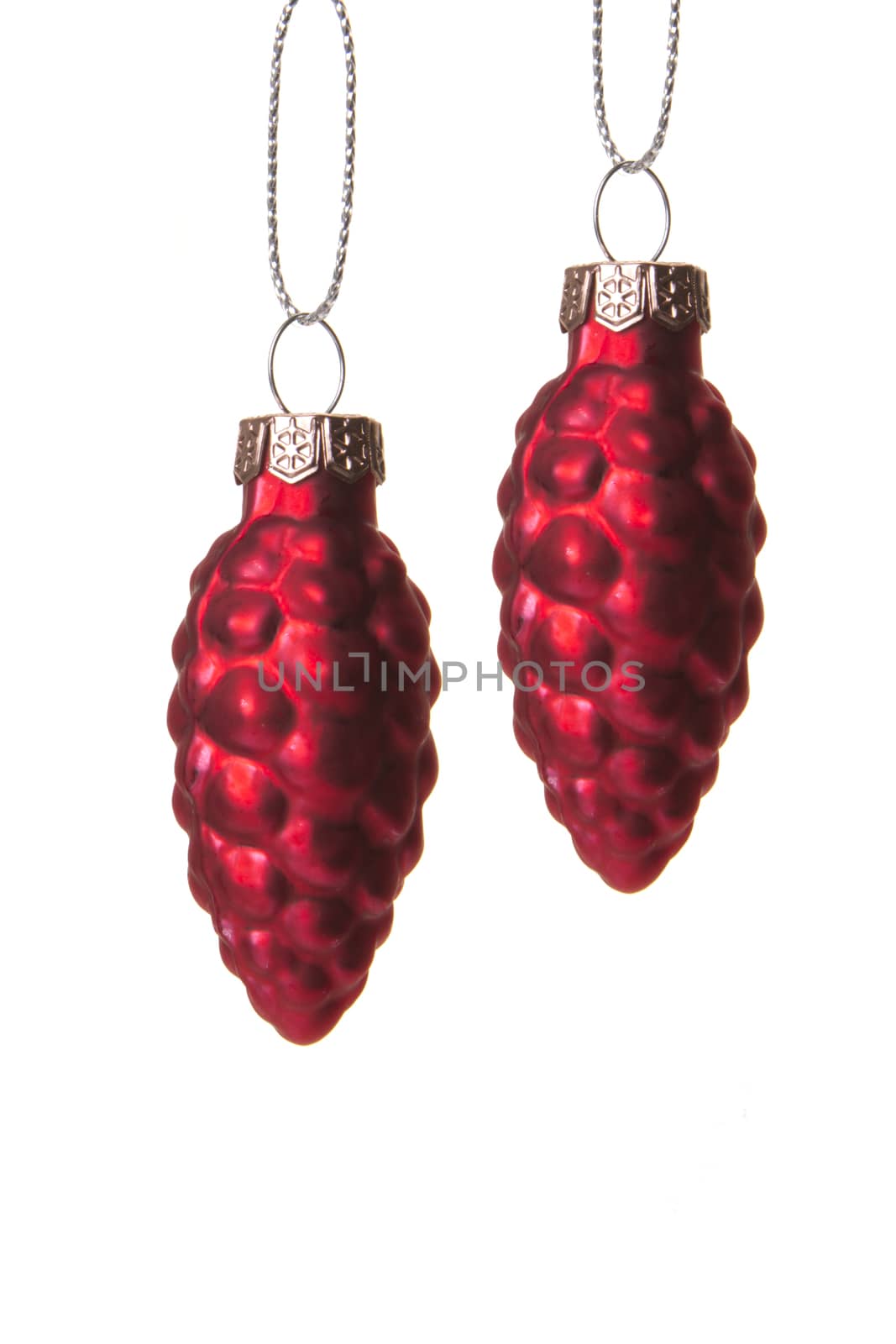 red christmas balls, form pine cone hanging isolated with white background 