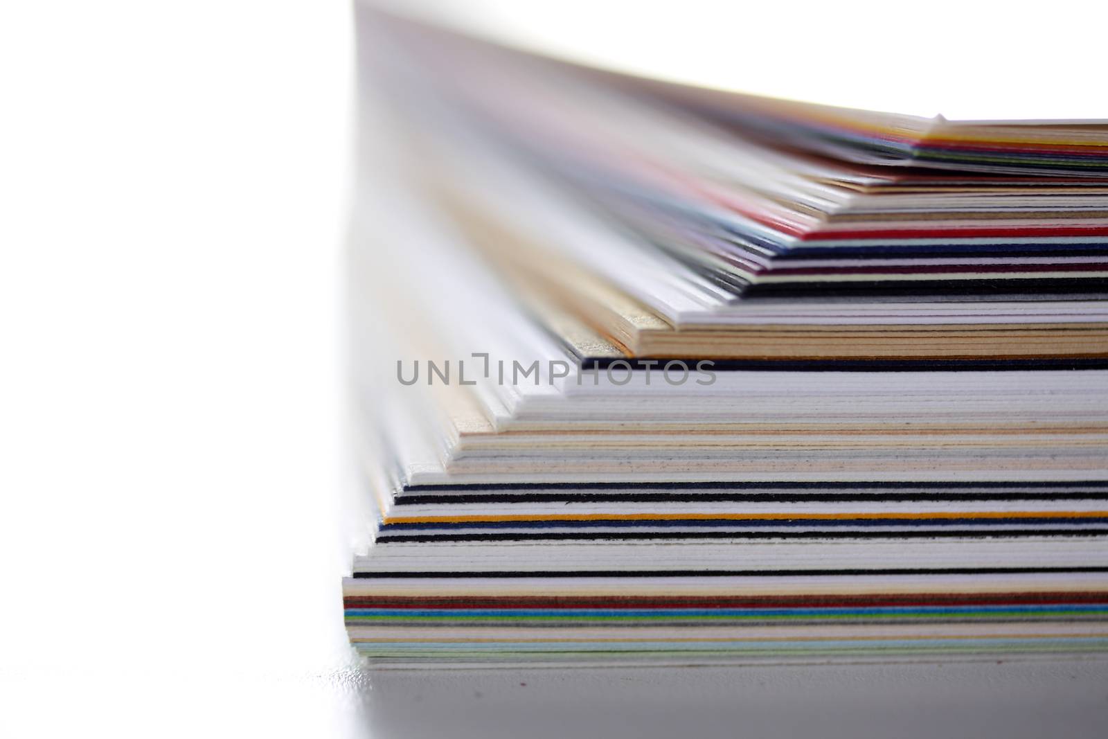 separating stacked sheets to organize a folder 