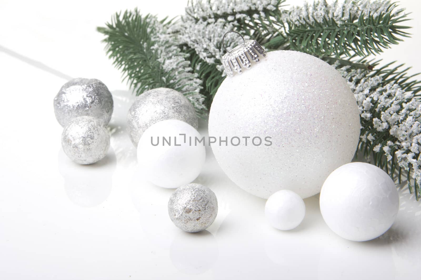 christmas, decoration with fir branch, pine cones, christmas bauble silver and white 