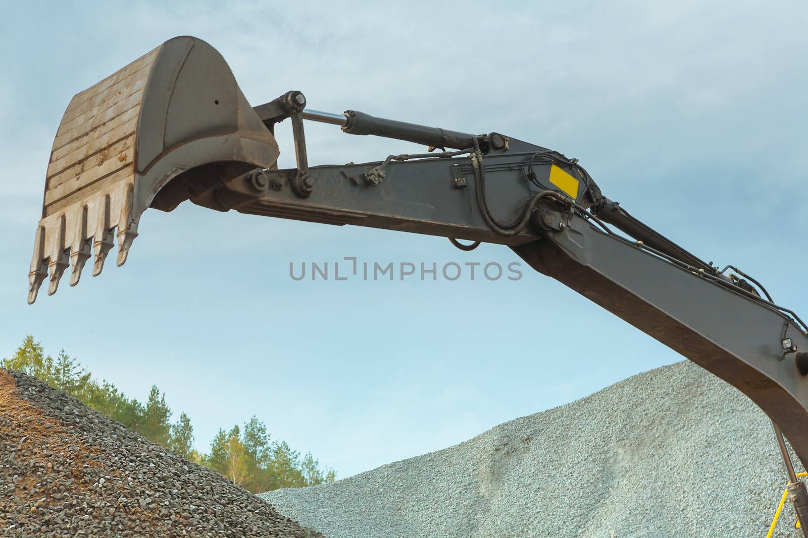 scoop of excavator on a background of sky