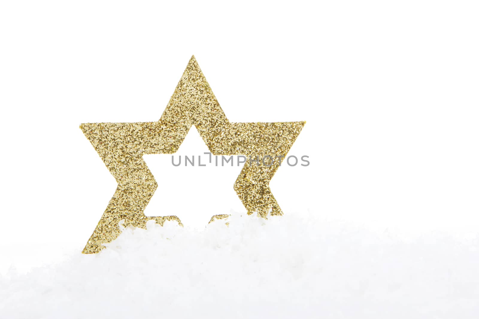 golden christmas star on snow 