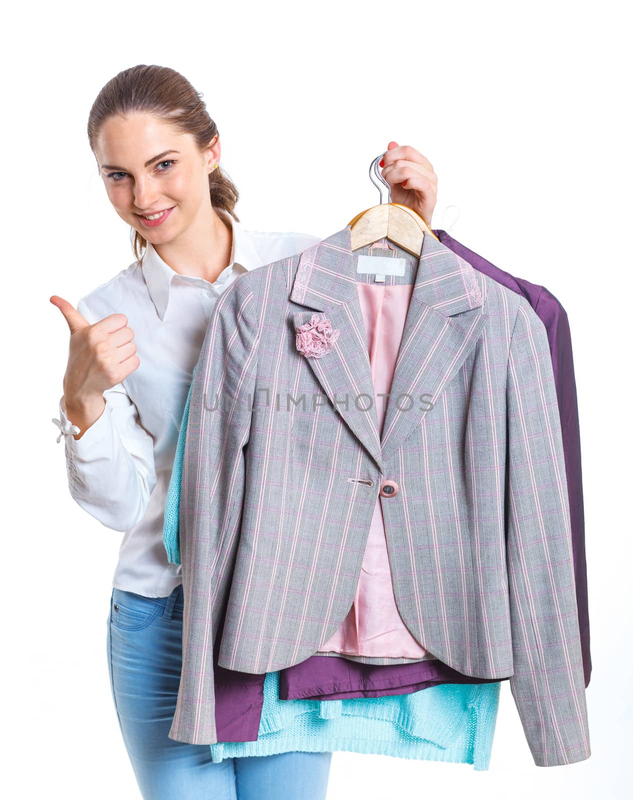 Studio picture of beautiful teenage girl with clothes. Isolated white background