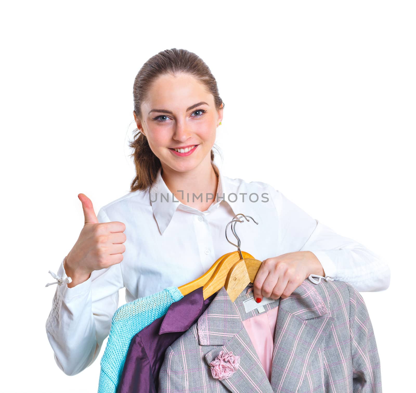 Studio picture of beautiful teenage girl with clothes. Isolated white background