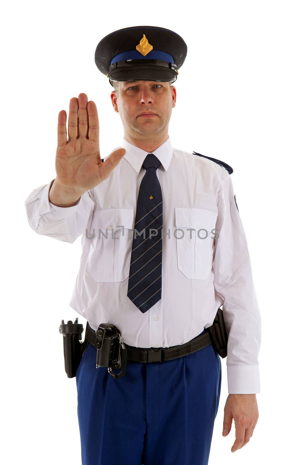 Dutch police officer is making stop sign with hand over white background
