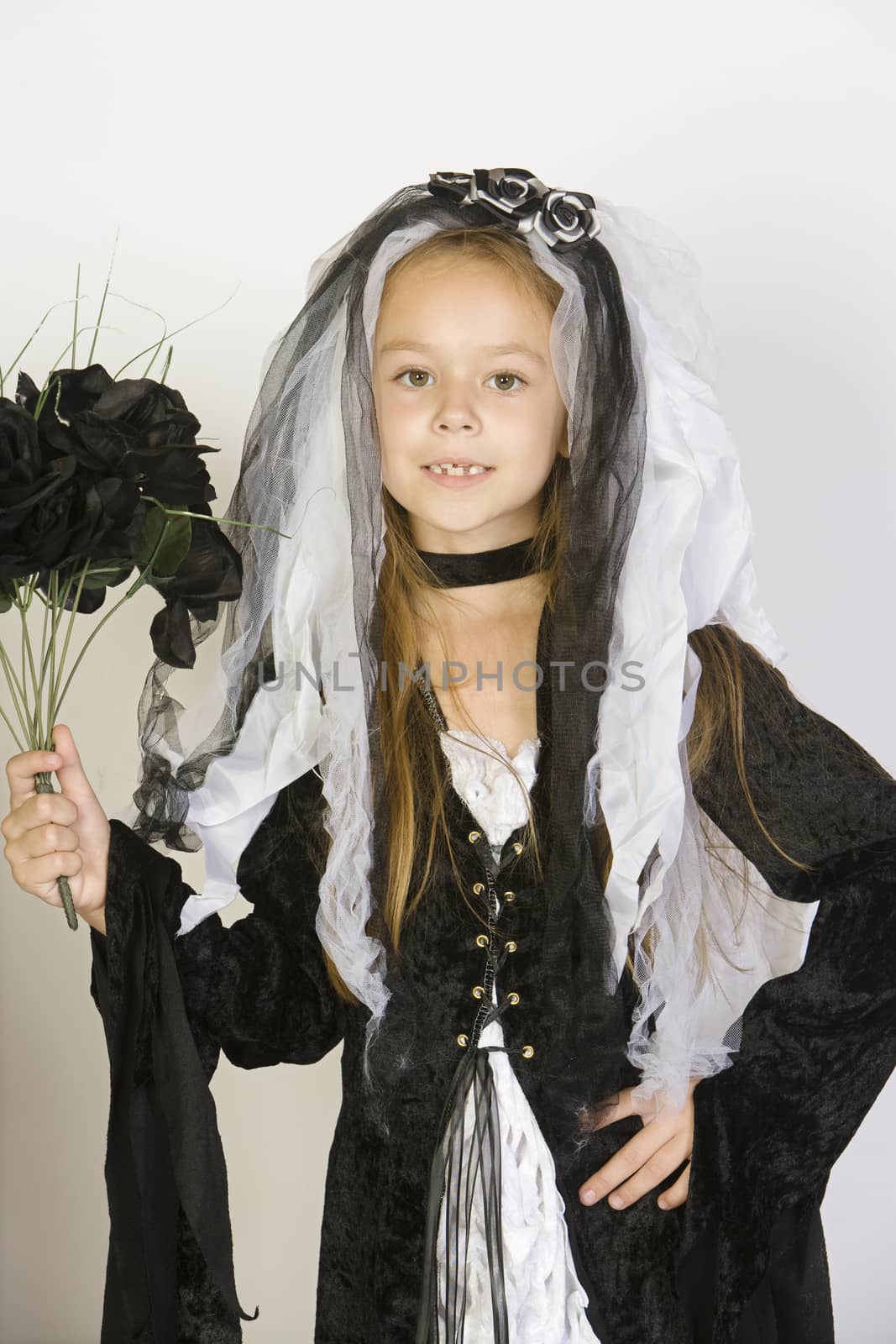 Portrait of girl (7-9) wearing Halloween costume by moodboard