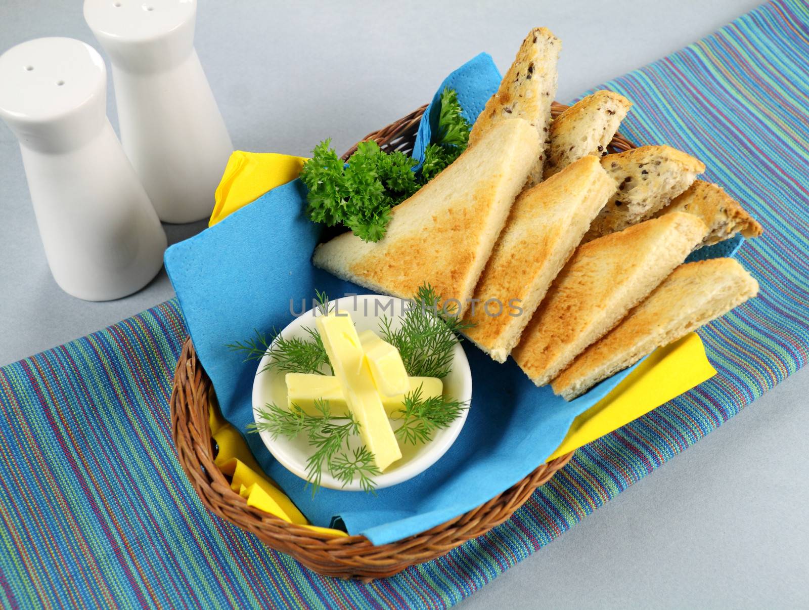 Crisp toast quarters with butter and Italian parsley.