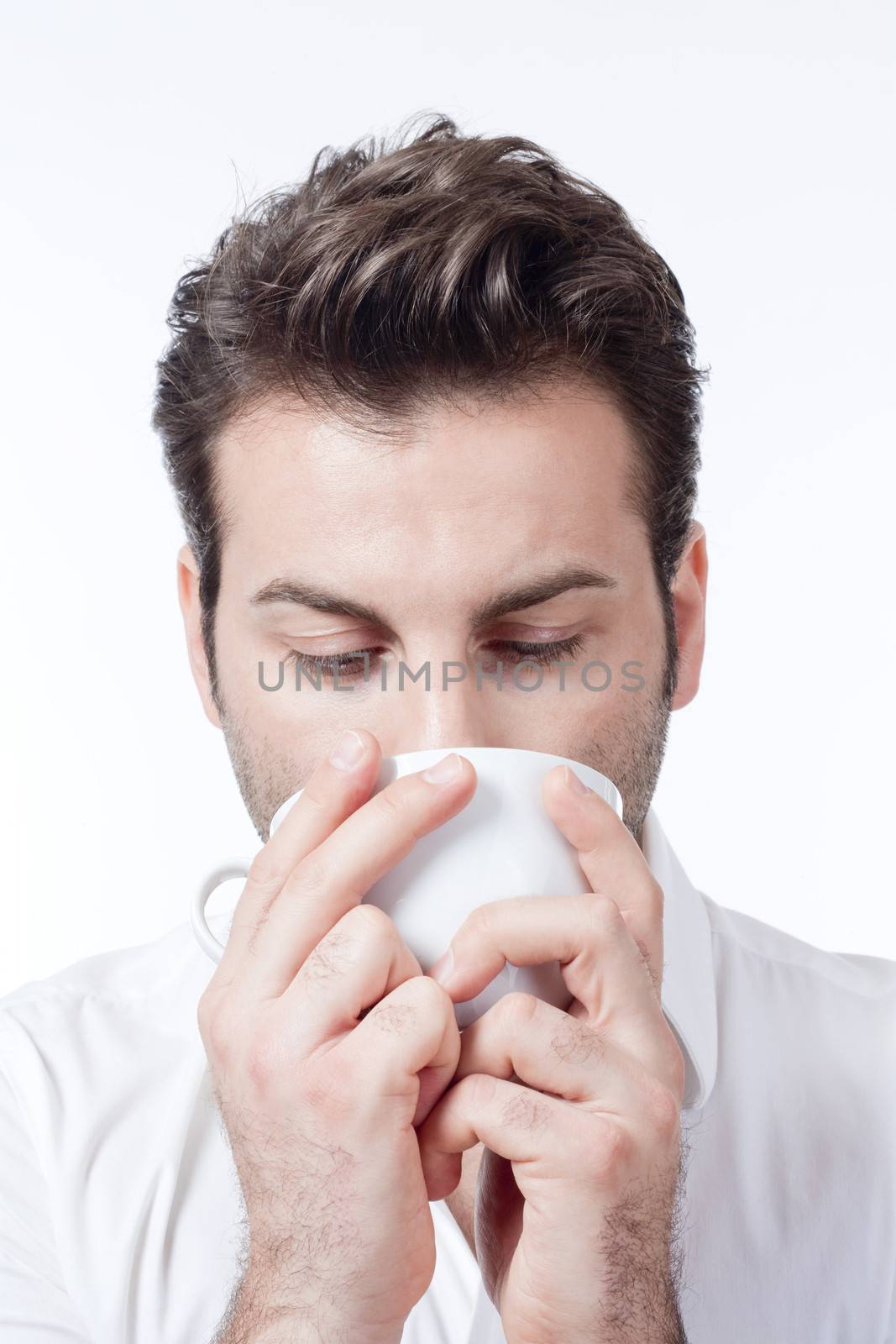 man in white shirt drinking cup of coffee - isolated on white