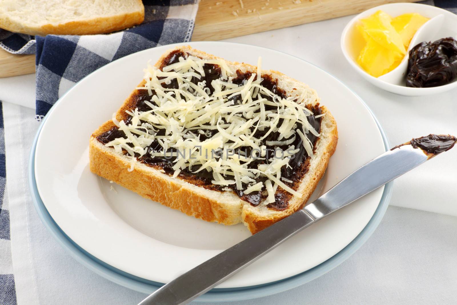 Vegemite sandwich with shredded cheese ready to serve.