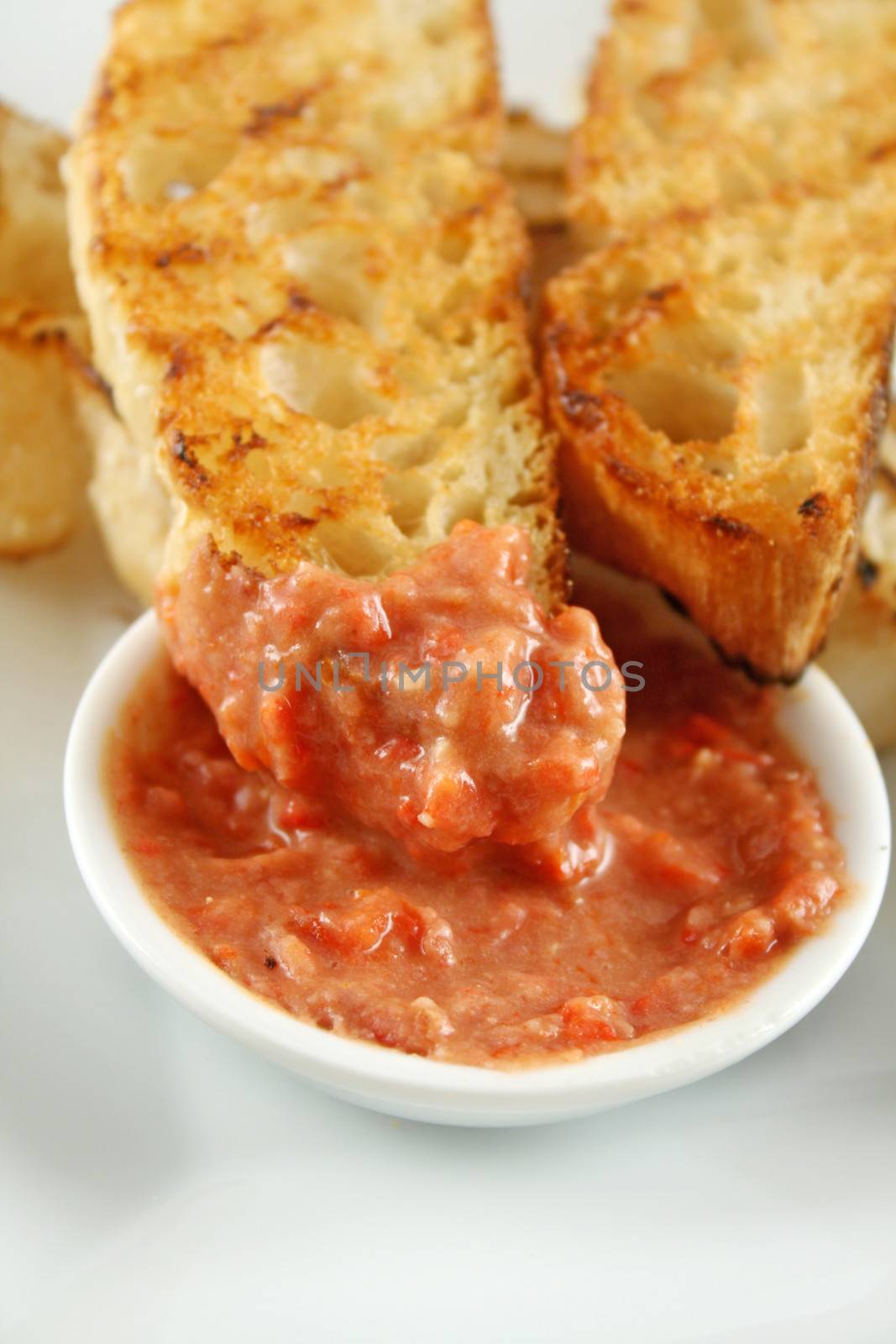 Delicious and colorful capsicum dip with grilled Turkish bread.