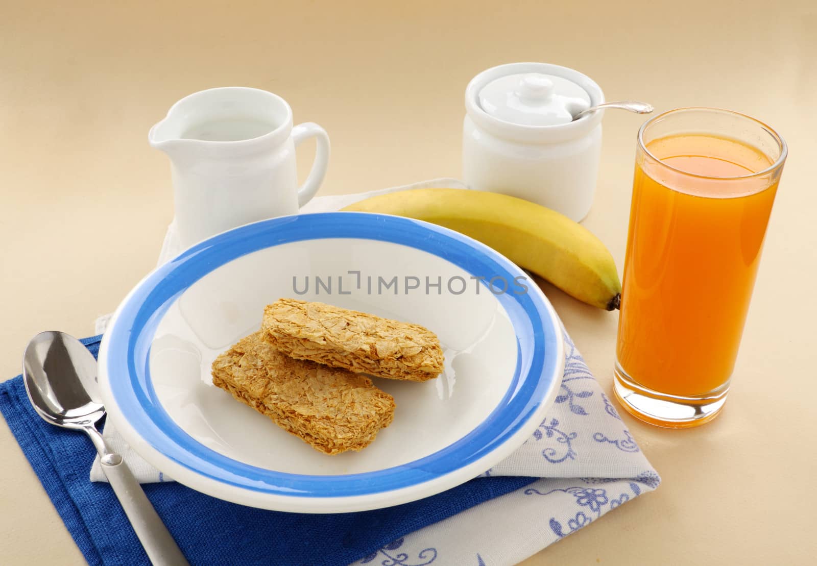 Iconic Australian breakfast cereal Weet Bix served with juice and milk.