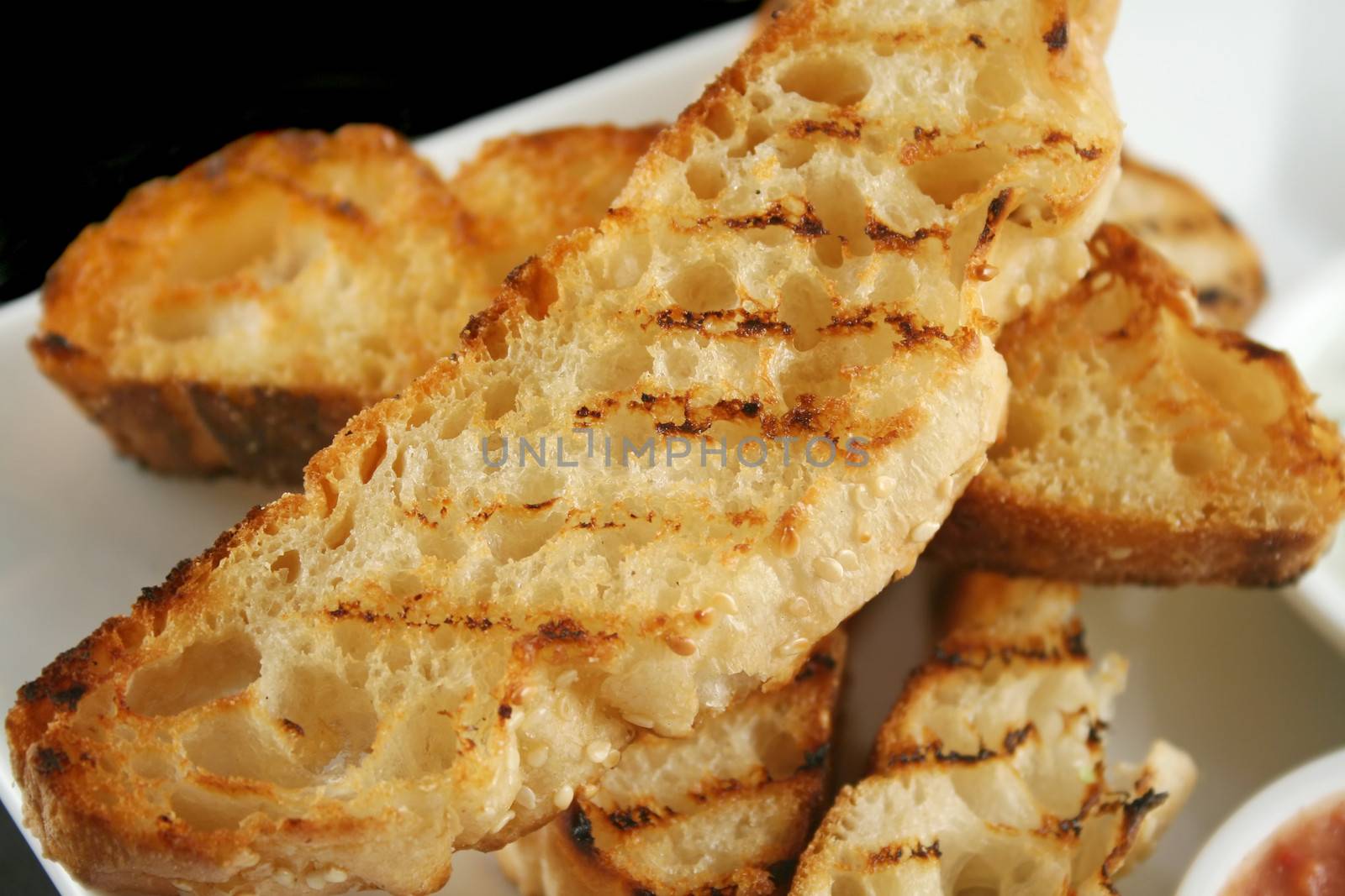 Slices of crisp golden grill toasted Turkish bread.