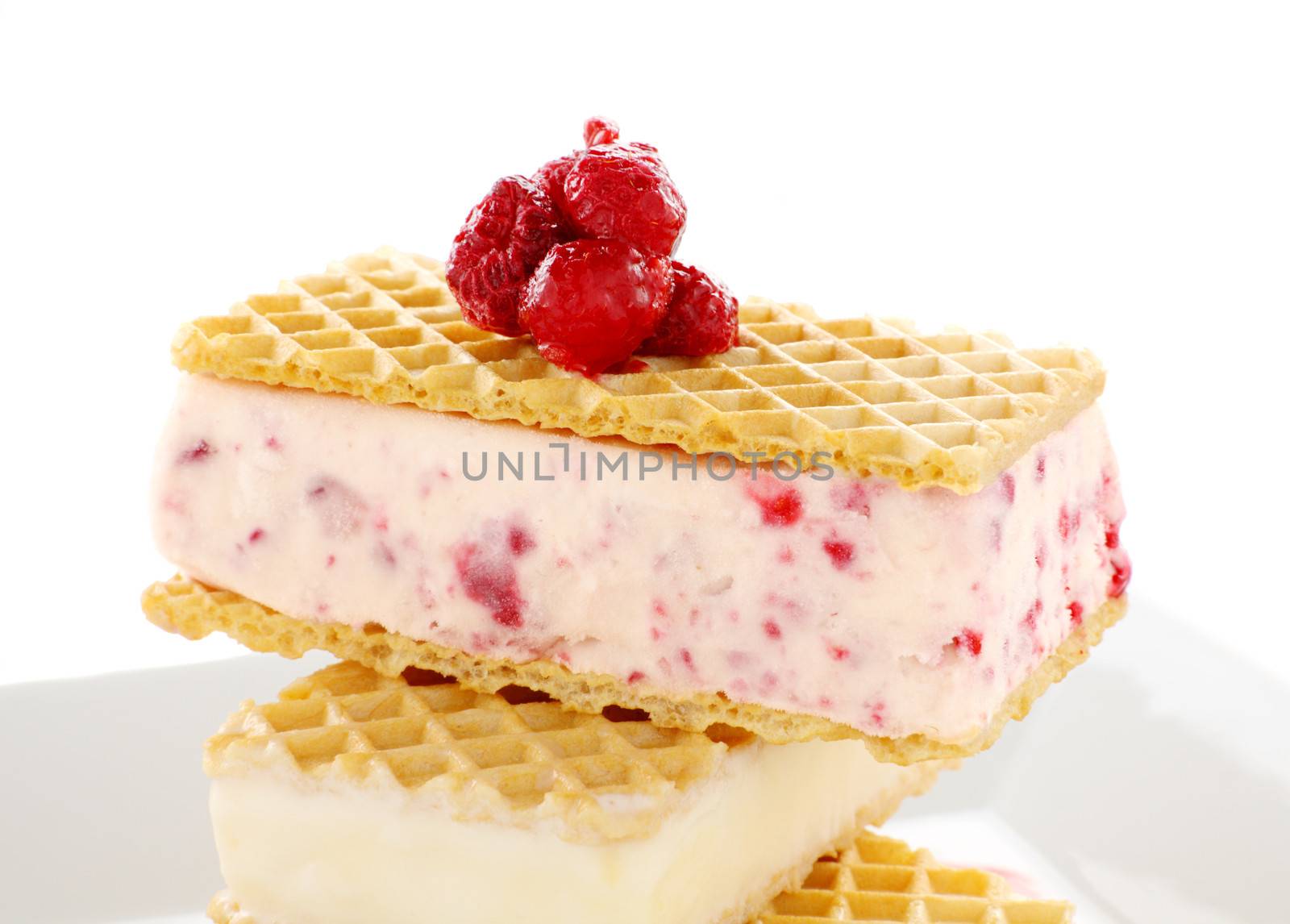 Delicious triple decker wafer ice cream with raspberry and vanilla ice cream.