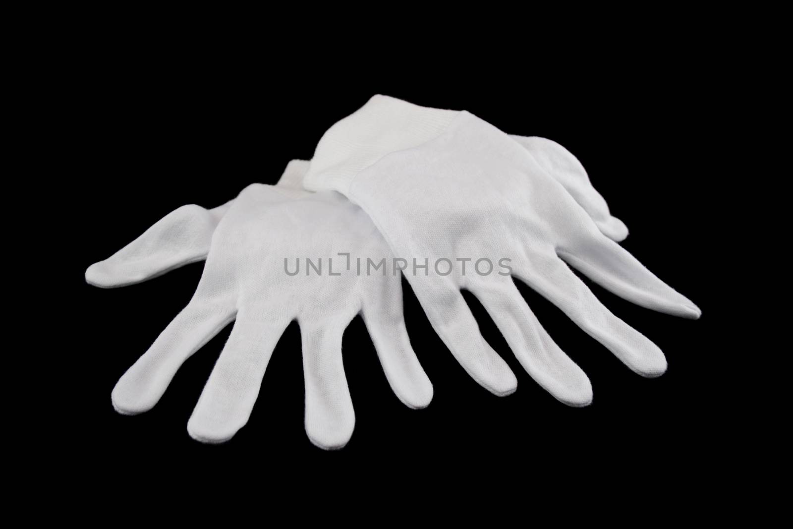 Pair of white gloves with one hand over the other.