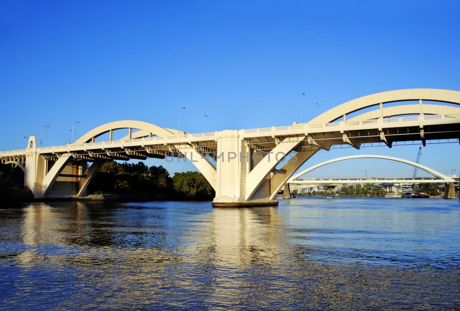 The William Jolly Bridge Brisbane Australia seen from the Brisbane River just after sunrise.