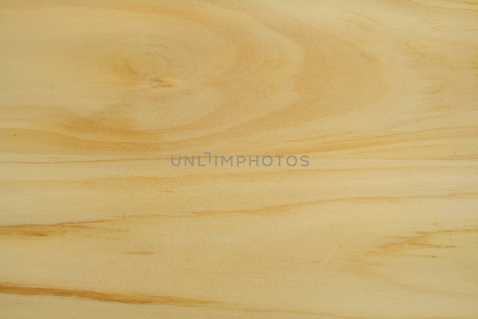 Light colored wood grain textured background with streaks.
