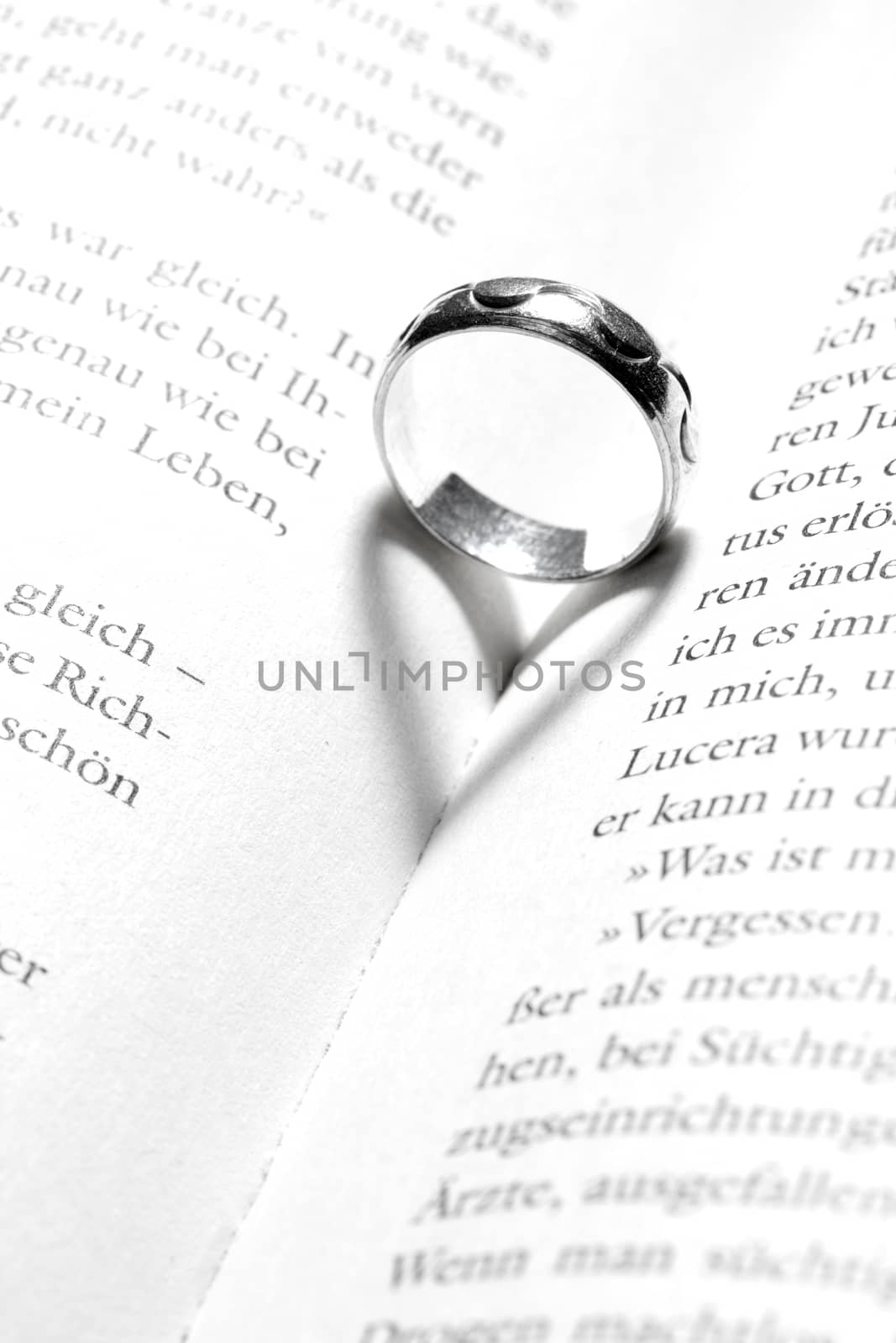 heart in a book by a ring