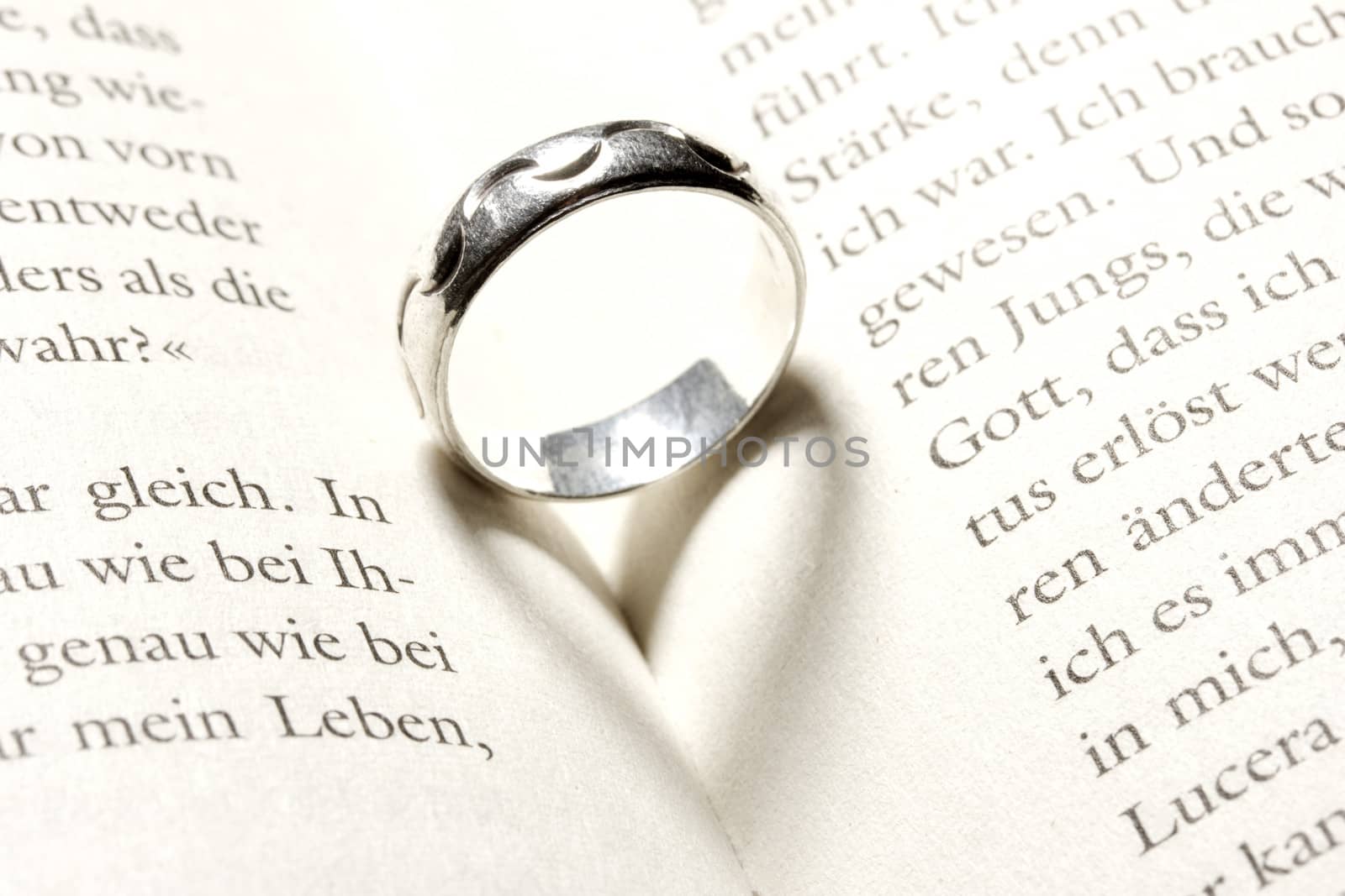 heart in a book by a ring