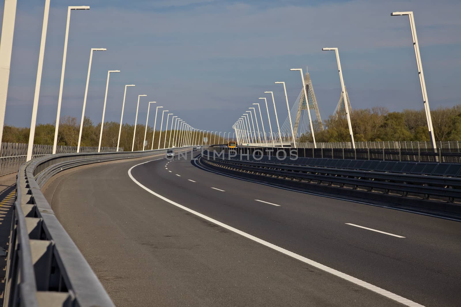 Highway over a bridge with little traffic