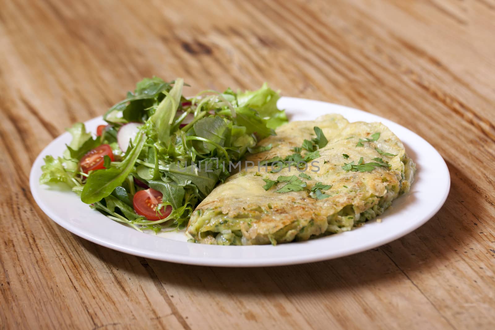 ramsons-cheese noodles with spring salad with wooden background