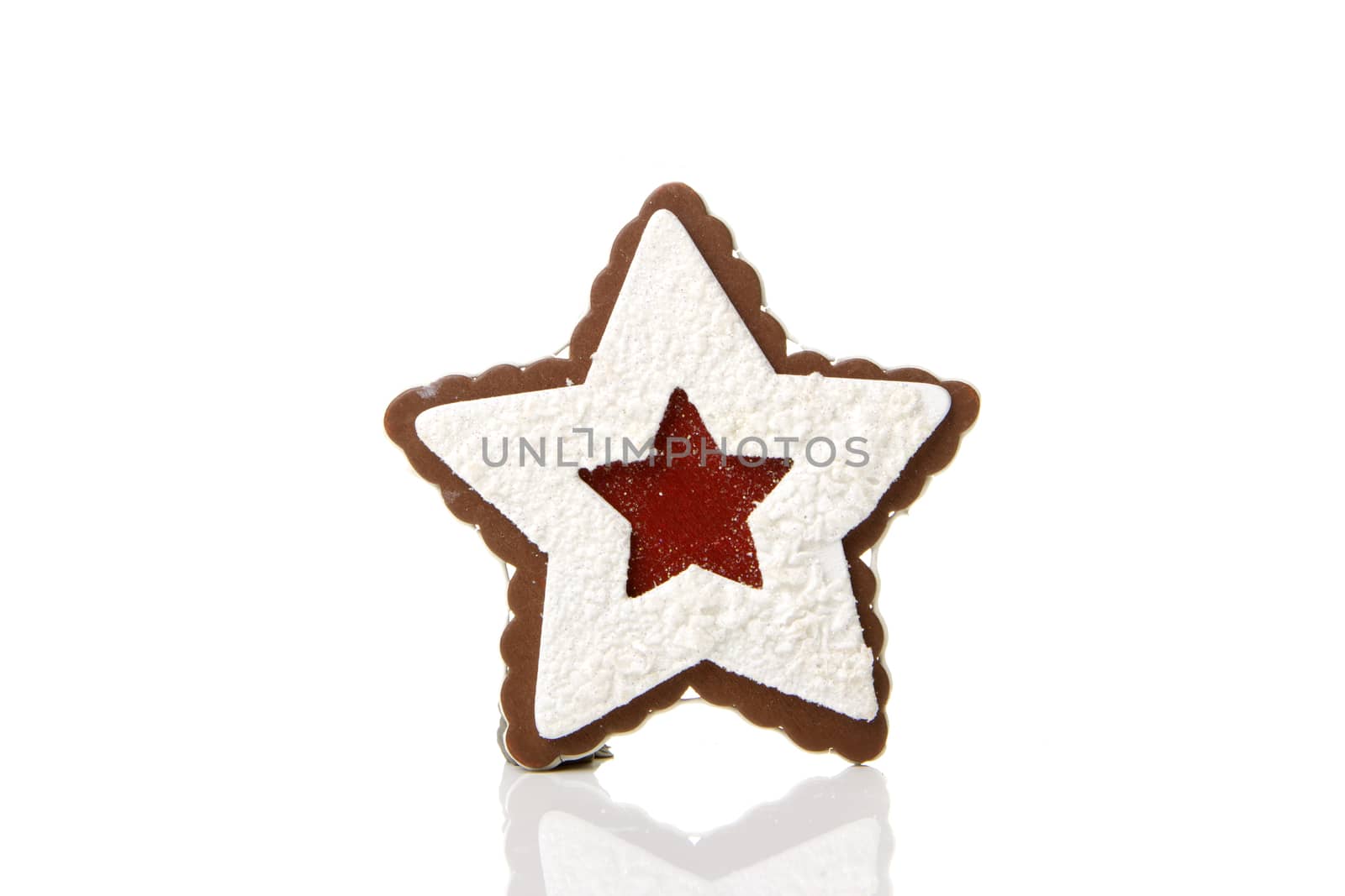 Gingerbread star as a Christmas decoration with white background