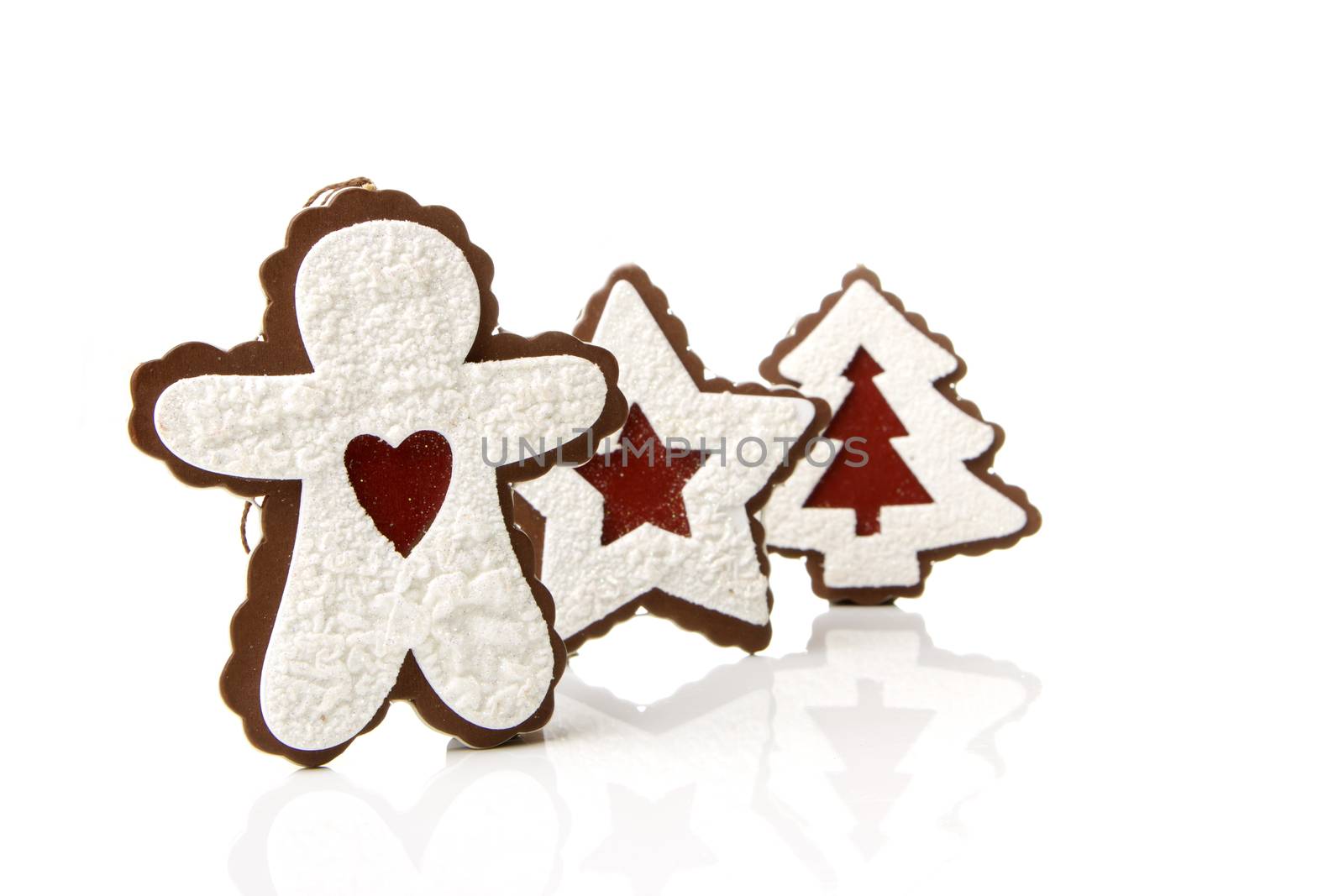 Gingerbread man, christmas tree, star as a Christmas decoration with white background
