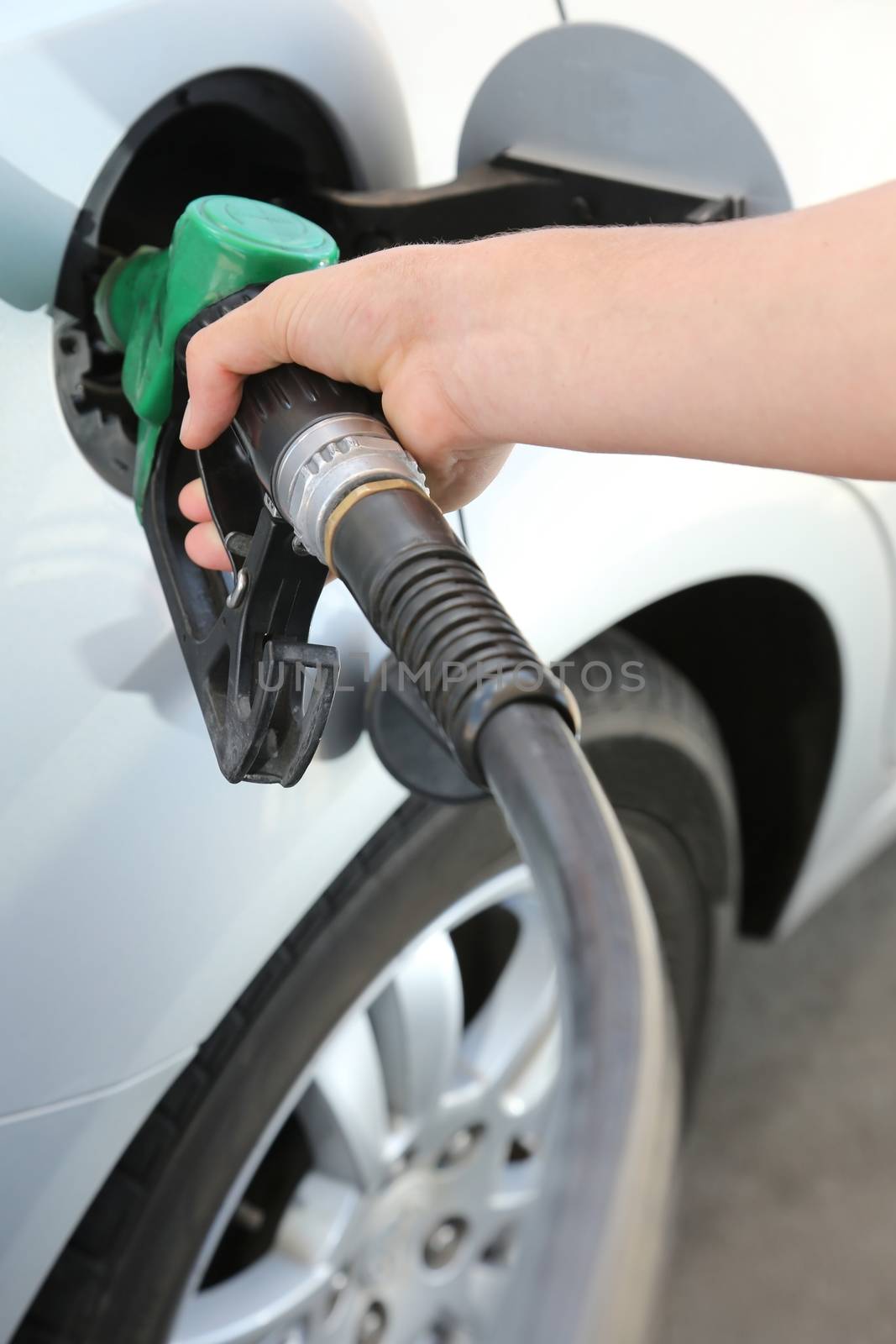 Petrol or gasoline being pumped into a motor vehicle car