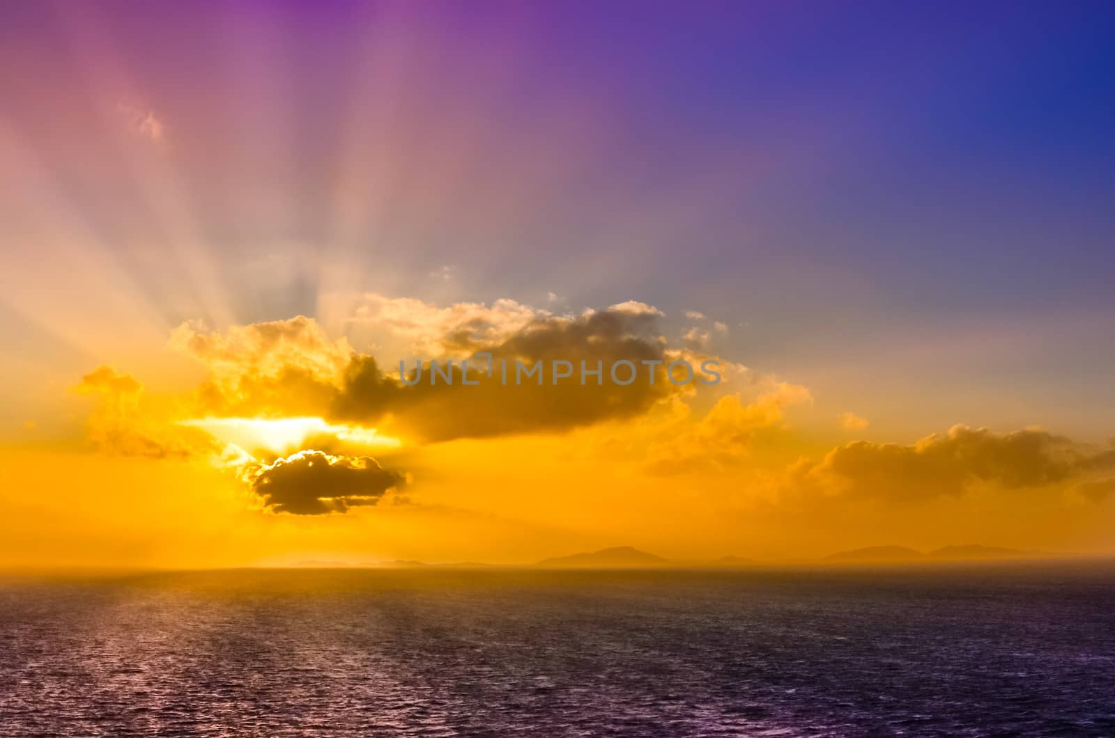 Ocean landscape sunset with clouds and colorful blue sky