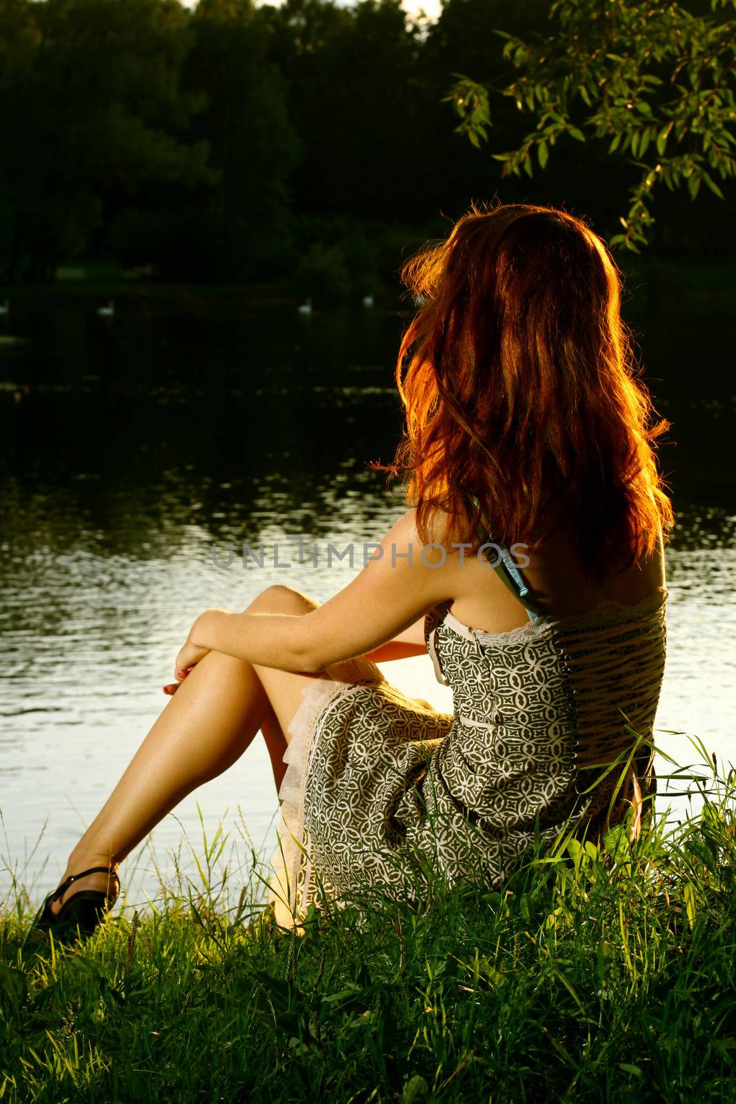 Girl sitting on tha bank of forest river by Yellowj