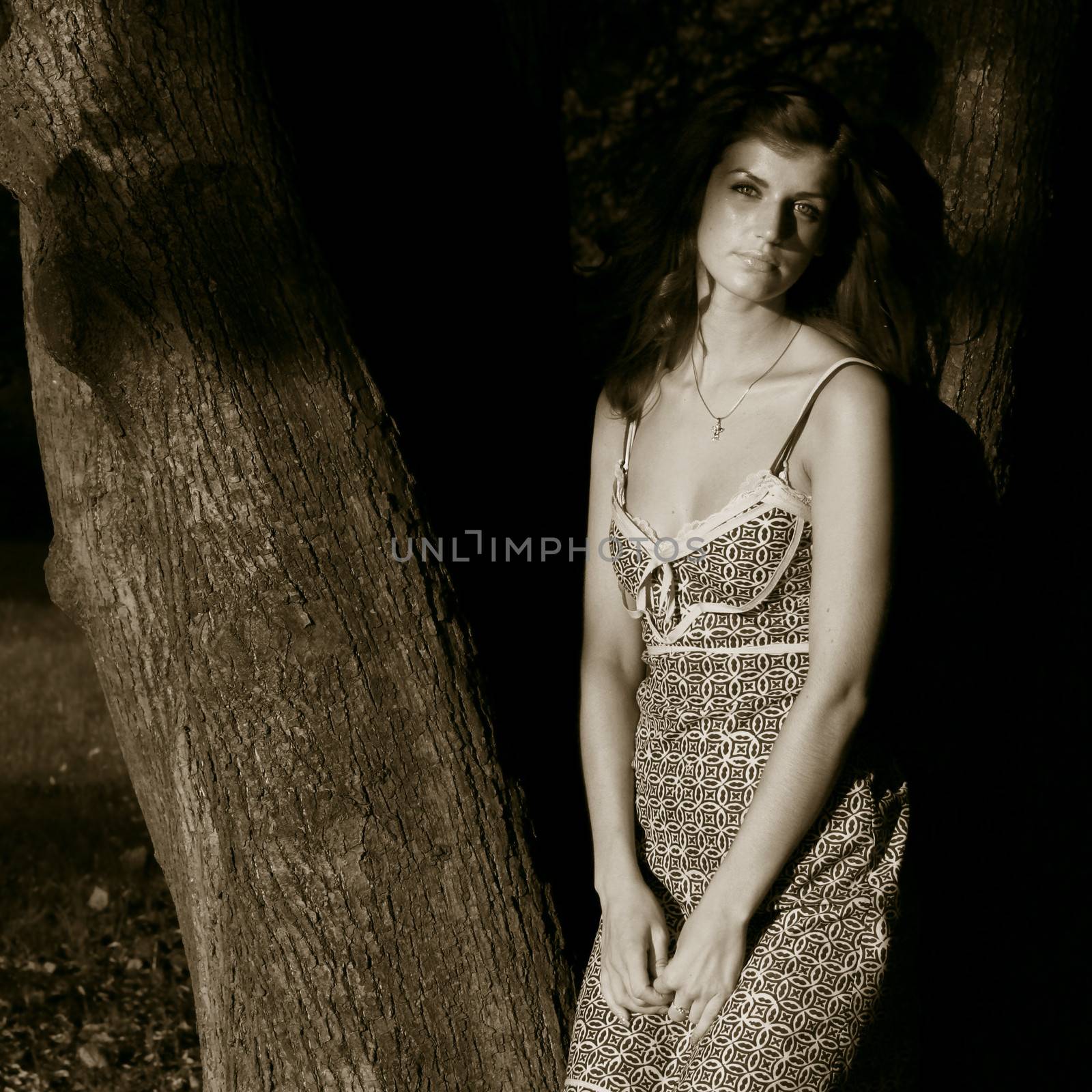 Beautiful young woman in summer forest