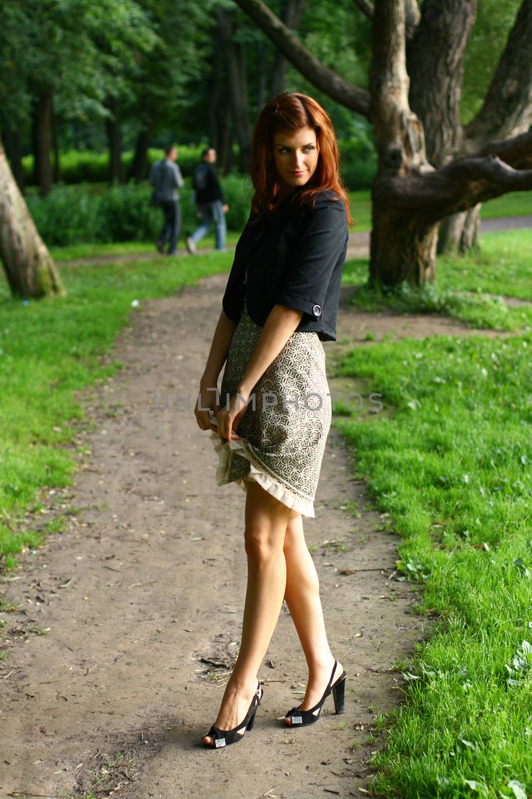 Beautiful young woman in summer forest