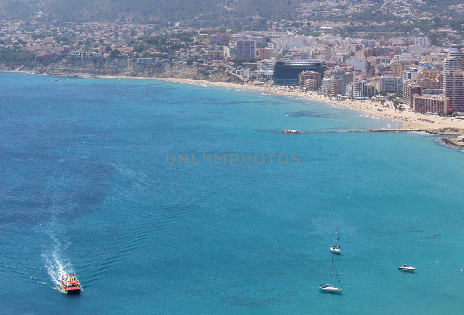 Panoramic view over Calp (Spain). Town bay beach