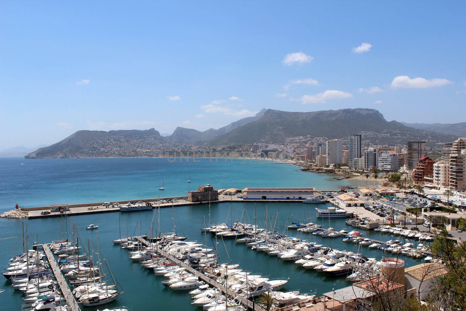 Panoramic view over Calp (Spain). Town bay beach