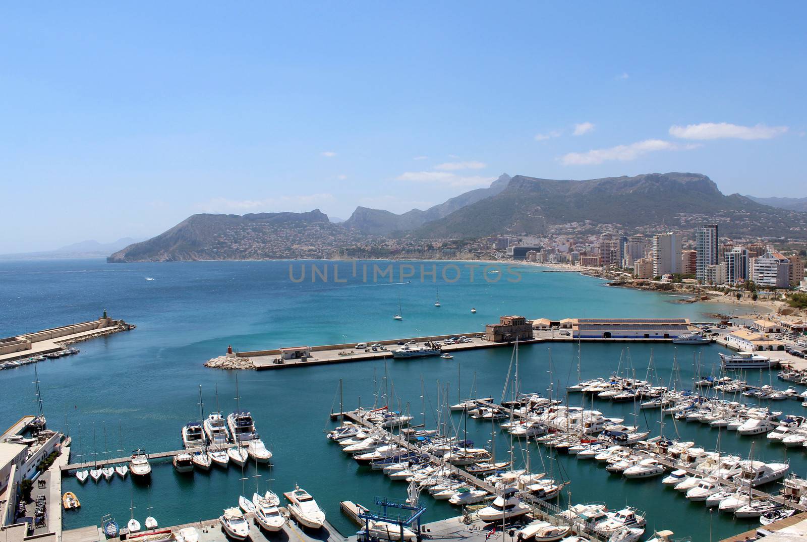 Panoramic view over Calp (Spain). Town bay beach