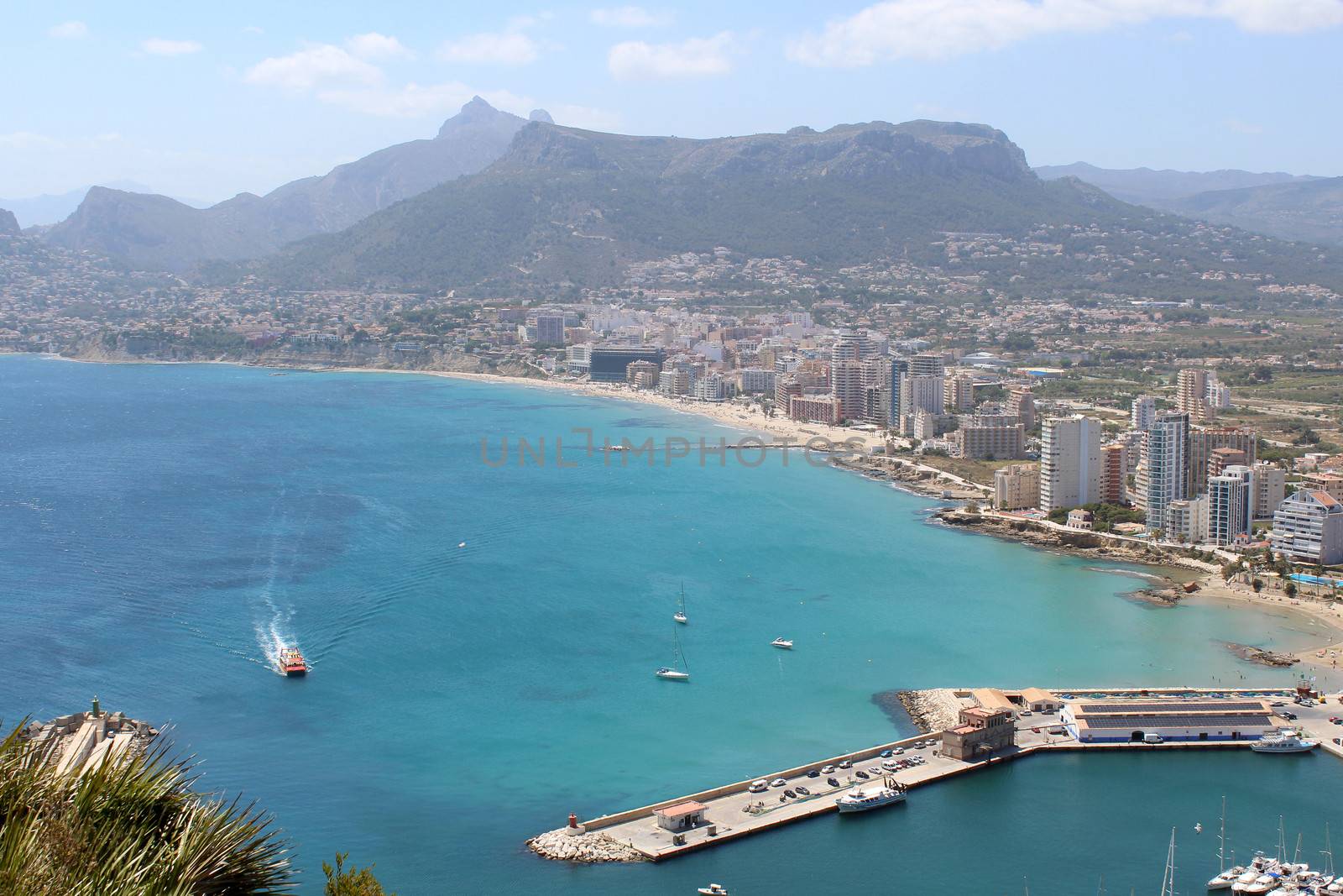 Panoramic view over Calp (Spain). Town bay beach