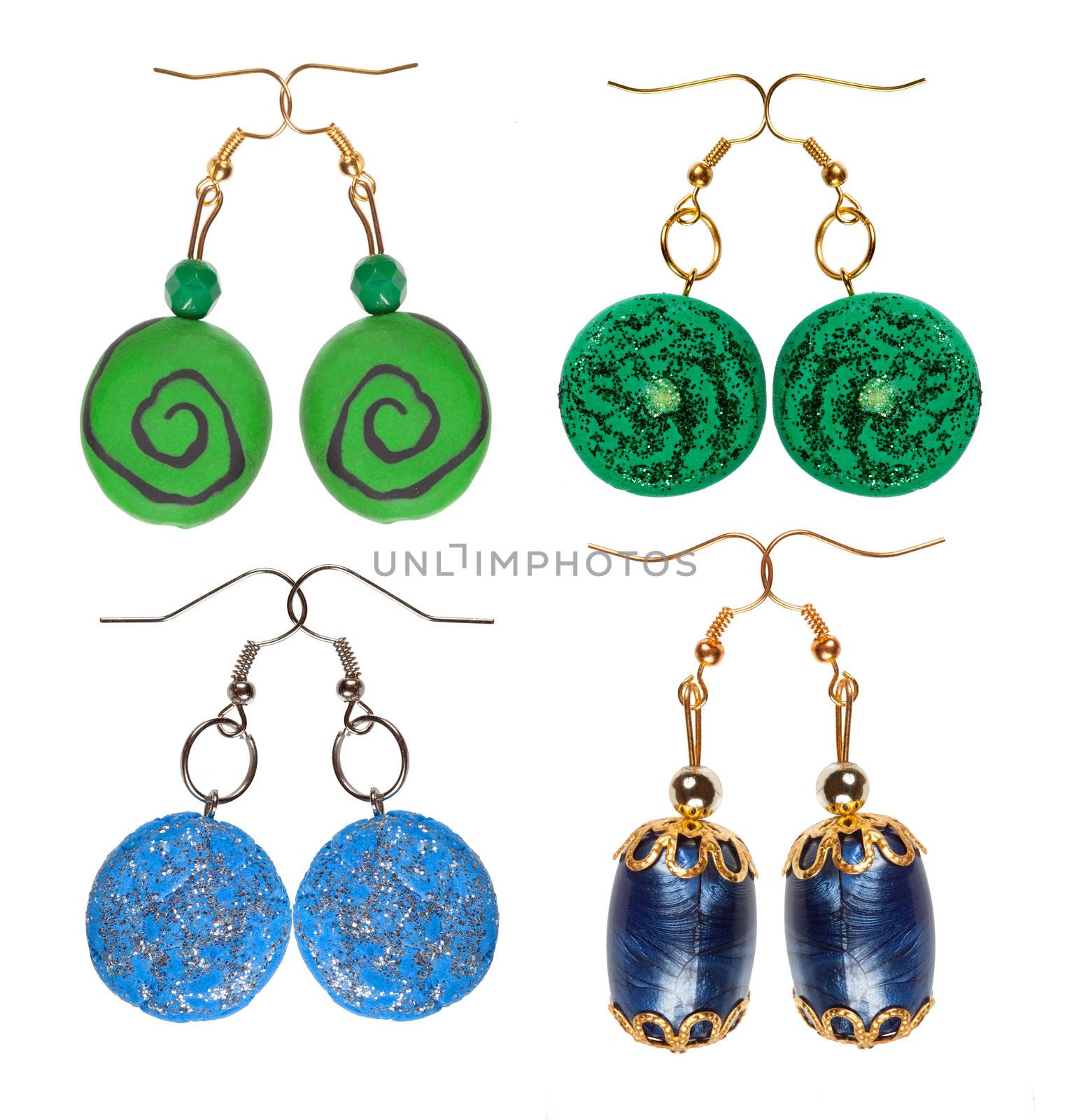 Earrings made of plastic and glass isolated on a white background. Four pairs blue and green. Collage.