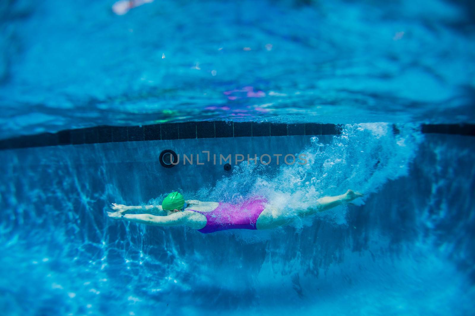 Girl Gliding Underwater Swimming by ChrisVanLennepPhoto